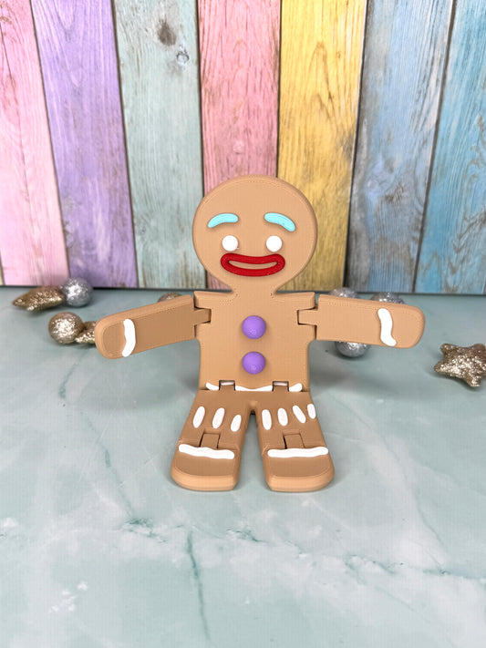 3D-gedruckter Lebkuchenmann mit frei beweglichen Armen und Beinen sitzend von vorne